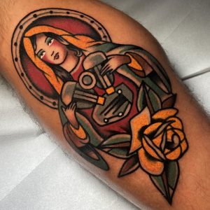 Traditional American Tattoo of Mother Marry with an engine